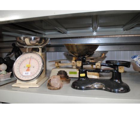 Three sets of scales and a collection of weights