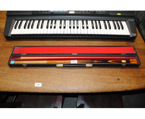 A Embassy snooker cue in carry case 