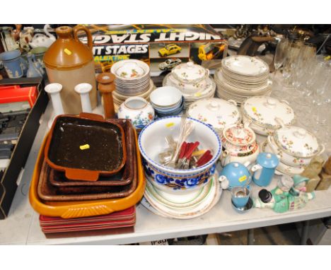 A collection of Wilkinson floral decorated dinner ware; various other dinner ware; stoneware bottle; place mats; cutlery; a p
