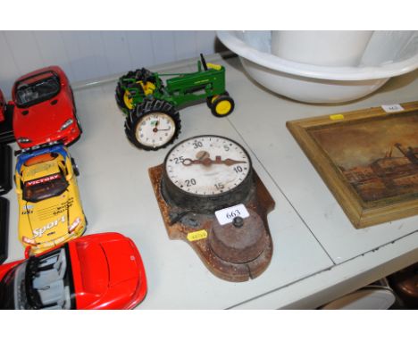 A John Deere clock in the form of a tractor and an Hanovia clock