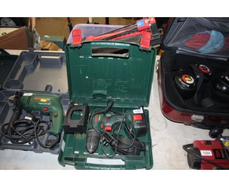 A Bosch PSR14,4 cordless electric drill with charger and battery in fitted plastic case with box of tools comprising clamp, t