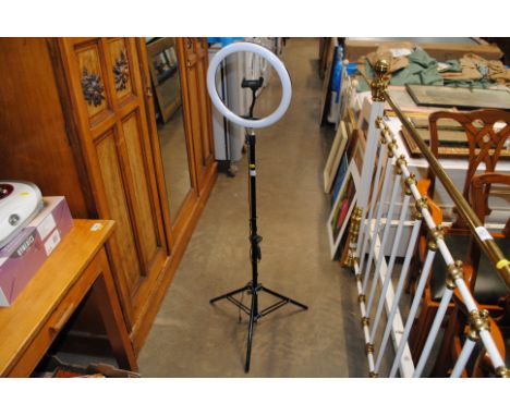 A selfie ring light on tripod