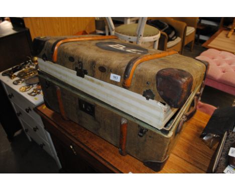 A canvas, wooden and leather bound trunk containing storage boxes