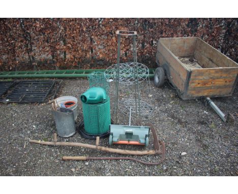 A quantity of various gardening items to include seed spreader, tools, netting etc.