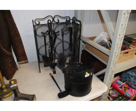 A fireguard, two companion stands and a coal scuttle