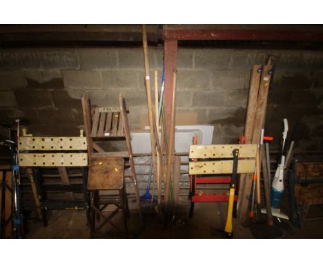 A quantity of long handled garden tools to include rake, hoe etc