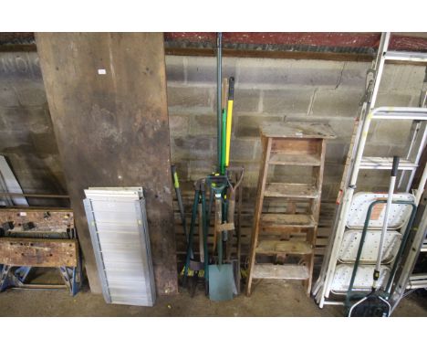 A quantity of garden tools to include digging fork, spade, broom, garden shears etc