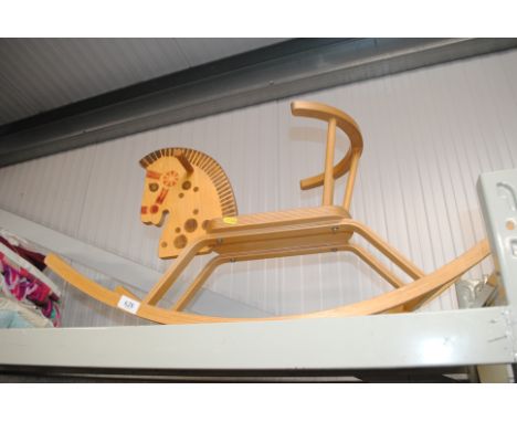 A wooden child's rocking horse