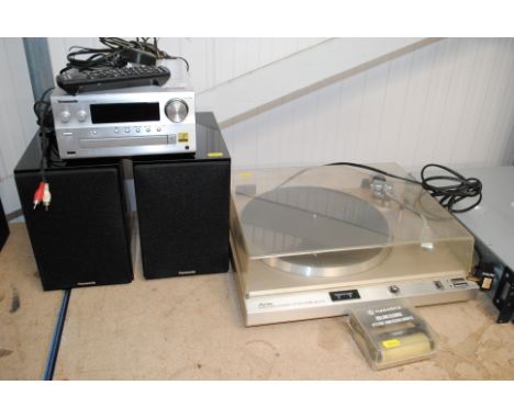 A Panasonic CD player SA-PMX100B with remote control; a pair of Panasonic speakers and a Aurex Quartzlock automatic return To