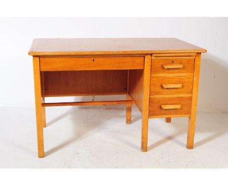 A vintage 20th century circa 1940s oak air ministry style office / school writing desk / table. Rectangular form with bank of
