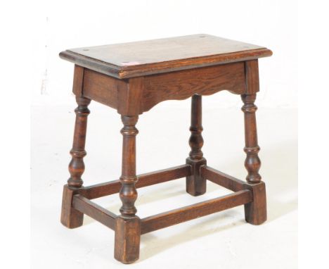 A vintage 20th century circa 1920s oak milking / joint stool. Turned supports with perimeter stretchers. Measures approx. 45x