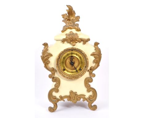 A 20th Century eight day movement painted metal mantel clock in cream ground with gold gilt relief flourishes decorating the 