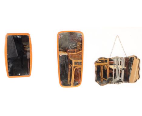 A collection of three vintage wall hanging mirror. One West German example, with a frameless deco one and a teak back ground 