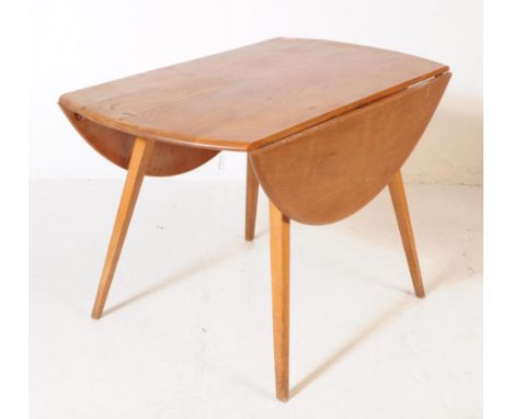 Lucian Ercolani for Ercol - A retro mid 20th century circa 1960s light beech and elm drop leaf dining table. The table having