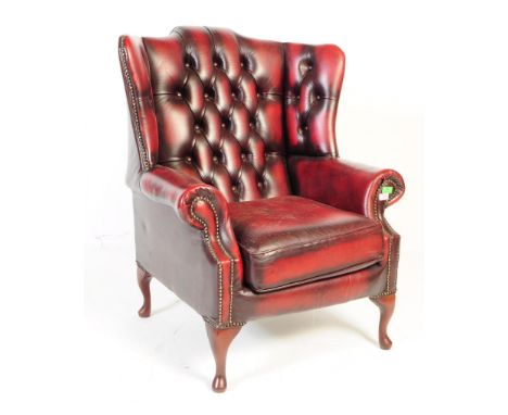 Queen Anne wingback / Chesterfield style button back club chair / library chair / fireside chair / armchair having a shaped b