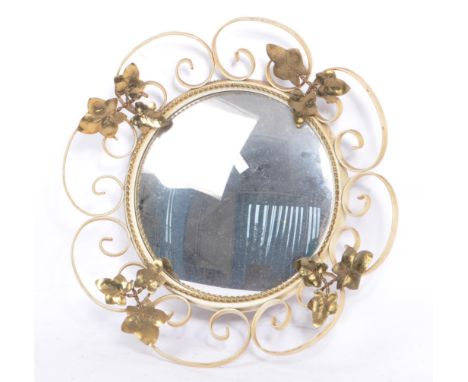 A mid 20th century vintage hanging wall clock. Of circular form with wire work decoration with gilt foliate leaves. With circ