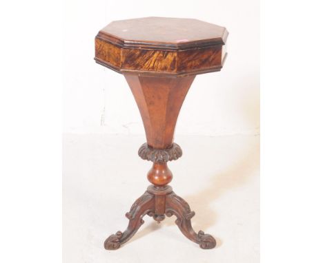 A Victorian 19th century burr walnut pedestal trumpet sewing box. Of octagonal form with hinged lid, on a tapering central co