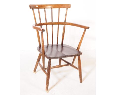 A 19th century Goldsmith Windsor armchair. Of beech and elm construction with comb / stick back with curved elbow rests on a 