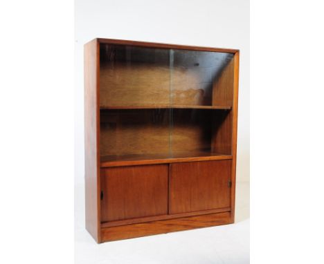 Herbert Gibbs - A mid 20th century Herbert Gibbs glazed bookcase display cabinet. The cabinet having a cupboard to lower port