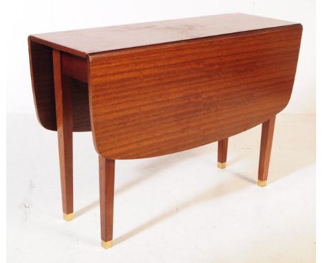 G Plan Furniture - A vintage 20th century drop leaf dining table. Rectangular form with curved drop leaves for extending purp
