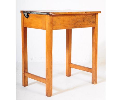 A mid 20th century circa 1940s light oak school desk having hinged top with sliding brass inkwell stamped up for Kingfisher W