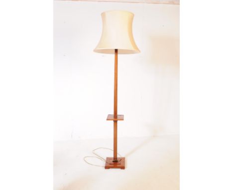 An early 20th century circa 1930s Art Deco oak floor standing lamp. The lamp having square base with central square tier, squ