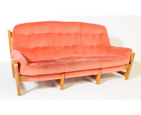 Ercol - A mid 20th century Ercol Wychwood beech and elm three seater sofa settee. The sofa having a wooden frame featuring a 