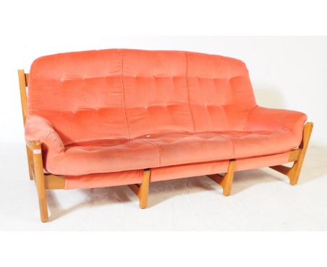 Ercol - A mid 20th century Ercol Wychwood beech and elm three seater sofa settee. The sofa having a wooden frame featuring a 