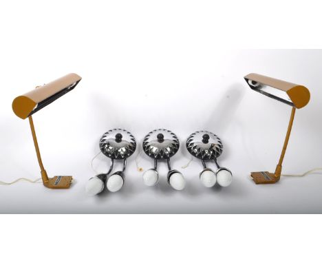 A matching pair of wall mounted brass and steel metal wall mounted gallery picture light / lamps With cylindrical curved desi