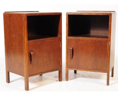A pair of vintage 20th century dark oak bedside table / cabinets. Square form with shallow gallery back, pigeon hole above si