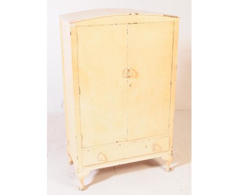 A vintage 20th century painting kitchen store cupboard / larder. Having a domed top with twin cupboard doors with a spacious 