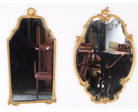 Two vintage Hollywood revival gilt wall hanging mirrors. With ornate gilt foliate frames, bevelled edge central glass panel w