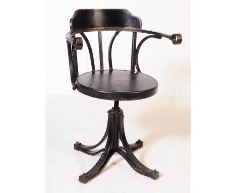 A vintage 20th century ebonised metal desk swivel chair. Having an shaped back rest with curved elbow rests. Circular seat on