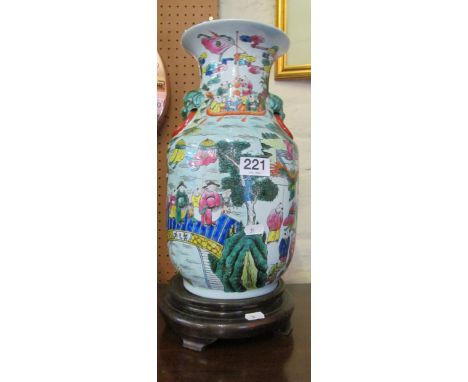 An oriental vase on wooden base (hole as lamp)