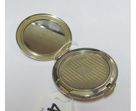 A Kigu silver compact decorated flowers