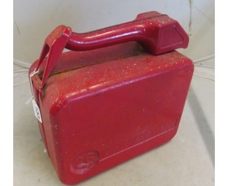 A two gallon vintage red jerry can with built in spout