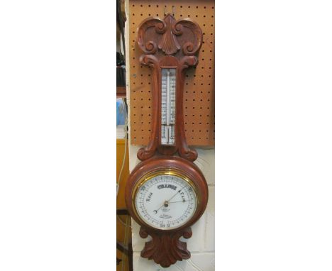 A Victorian oak cased barometer/thermometer