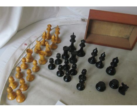 A chess set (one black missing knights head and an extra larger Bishop) and a backgammon box