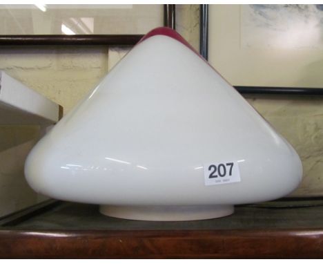 An opaque and red glass lamp