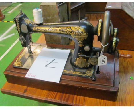 A Singer vintage hand sewing machine