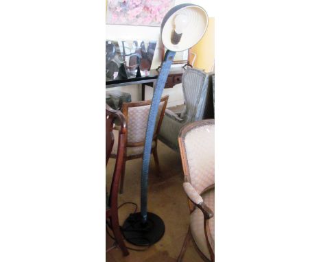 A black adjustable floor standing lamp