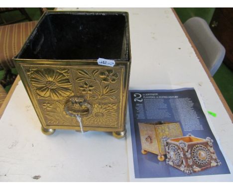 An Aesthetic movement brass jardinière dated 1878, of square form, each panel embossed with alternating flowers, the whole ra