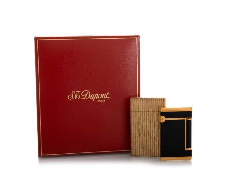 S.G DUPONT, TWO GOLD PLATED CIGARETTE LIGHTERS 20TH CENTURY one in original fitted case, the other with black enamel detailQt