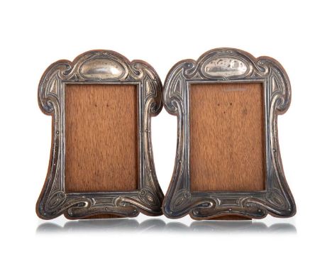 PAIR OF EDWARDIAN SILVER ART NOUVEAU PHOTOGRAPH FRAMES REYNOLDS & WESTWOOD, BIRMINGHAM 1905 each of shaped oblong form, embos