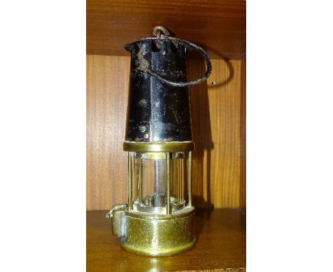 A vintage brass and metal miner's safety lamp stamped 109 and 54/2904 P, 25cm high. 
