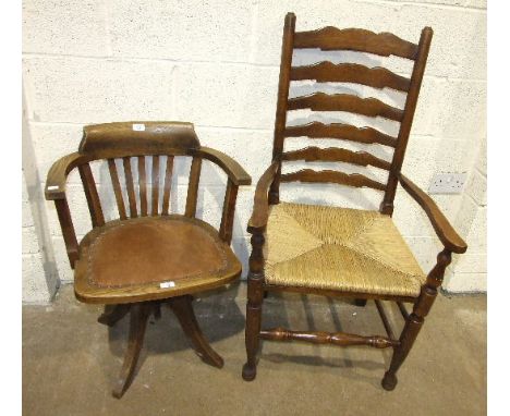 An oak revolving office armchair with padded seat and a set of six stained wood ladder-back dining chairs with rush seats, (i