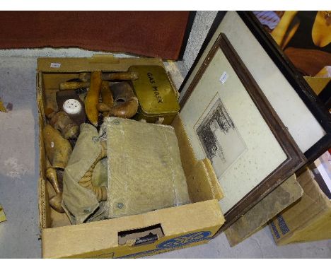 A pair of carved wood and leather bellows, 52cm, two pairs of wooden shoe trees, a wood and ceramic lemon squeezer, a gas mas