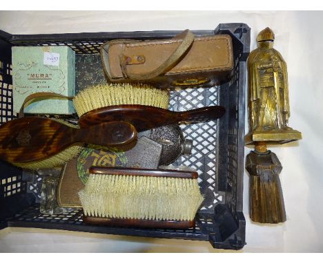 Two 'tortoiseshell'-backed hair brushes and two matching clothes brushes with gold initials, a brass cigarette lighter in the