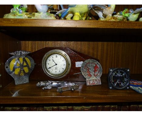 A Smith's car clock mounted in wooden case, a chrome-plated Jaguar car mascot and a BMA and AA car badge. 