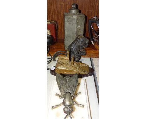 A Continental pewter octagonal-shaped cannister and lid etched HK 1685, 29cm high, a cast metal nutcracker in the form of a s